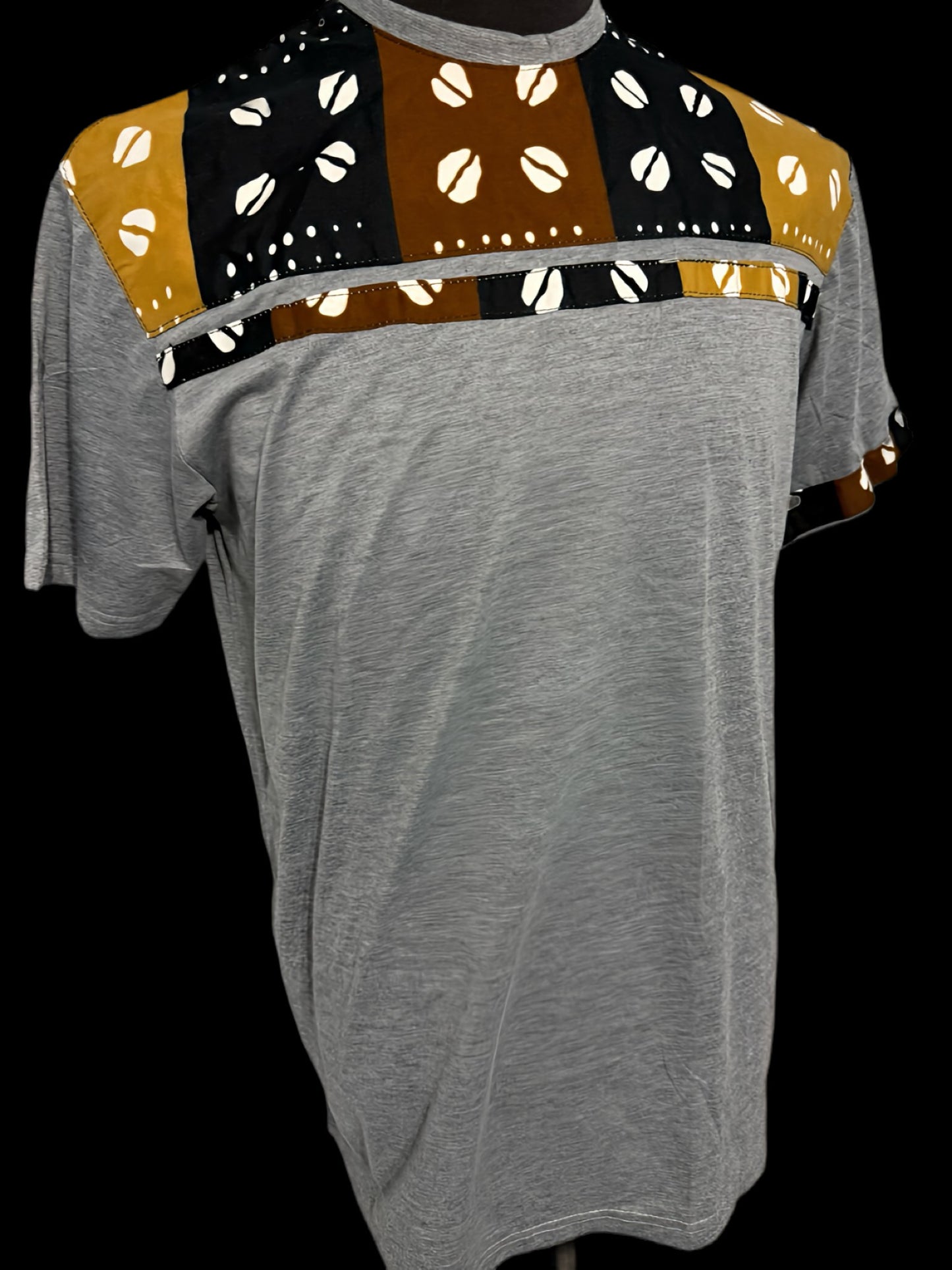 grey t-shirt with cowries